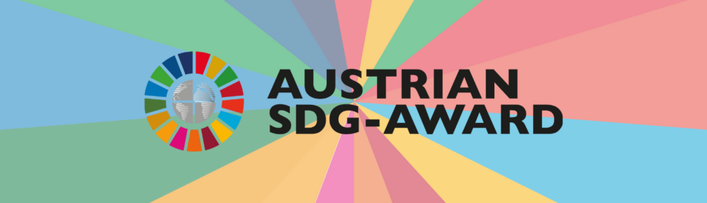 Logo des Austrian SDG-Award: Bunter Kreis mit Symbolen der nachhaltigen Entwicklungsziele und Text "Austrian SDG-Award" auf einem Hintergrund mit farbigen Strahlen.